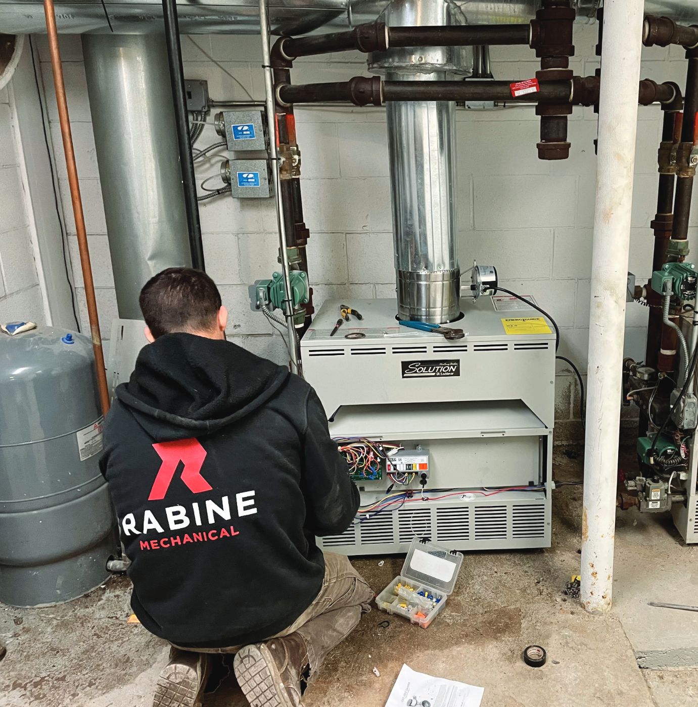 Rabine technician diagnosing a boiler control board
